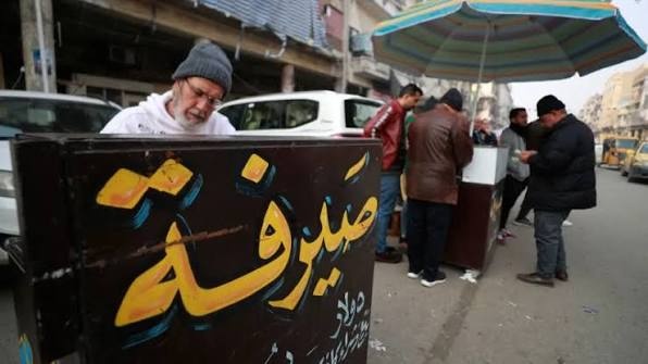 Dollar exchange rate slightly declines in Iraqi markets as security campaigns target violating exchange offices - سعر الدولار الدينار العراقي أسواق الصيرفة الاستقرار النقدي dollar price Iraqi dinar